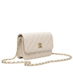 Chanel | Classic Flap Bag In Quilted White Lambskin Leather.