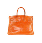 Hermès | Birkin Handbag Made From Crocodile Skin Orange Color