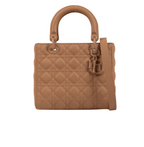 Dior | Bag In Beige Or Nude Lambskin With The Signature Cannage Stitching And
